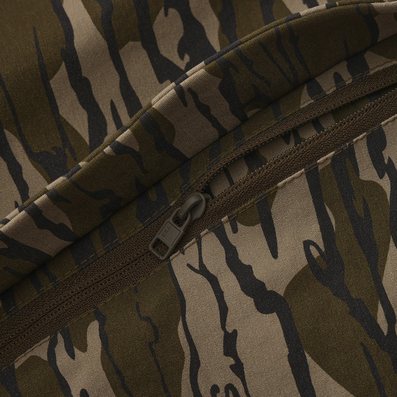 Close-up of the zippered pocket on Advantis lightweight Mossy Oak Bottomland hunting pants by North Mountain Gear