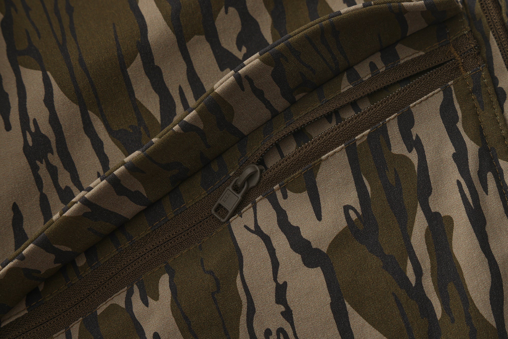 Close-up of the zippered pocket on Advantis lightweight Mossy Oak Bottomland hunting pants by North Mountain Gear